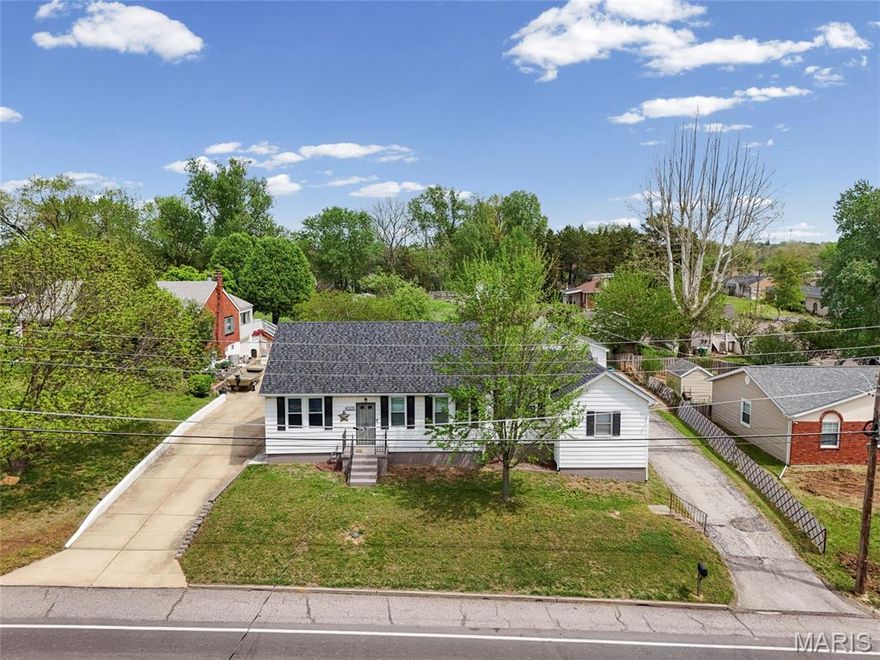 This UPDATED 4 bedroom home is adorable.  The home sits on nearly a half-acre of land, with a detached 2+ car garage, NO HOA, new kitchen with 42" modern cabinetry for lots of storage items, built-in fridge with pantry, ceiling fan, granite countertops, gas range, new appliances, deep farmhouse double sink, breakfast bar, and updated lighting. The main floor bath has just been updated with new ceramic tile and modern fixtures, and linen closet. Enjoy entertaining in the separate dining room and large living room with luxury vinyl plank flooring. The primary bedroom is on the opposite side of the home for privacy with large walk-in closet. Two additional bedrooms are large and spacious. The lower level has a large sleeping area, a full bath with walk-in shower and new fixtures, and a large recreation room. The storage room is big and has a newer HVAC system. The yard is a gem, spanning nearly a half-acre and featuring a large patio, landscaped garden area, playhouse/shed, room for extra parking for your camper or boat. Yard is fenced and level, and room for that pool you always wanted, and so much more.  You're not going to want to miss this one!