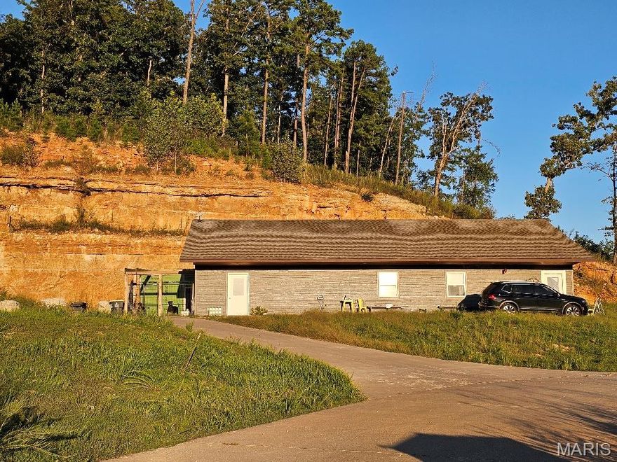 Versatile 2,400 Sq Ft Home on 1.67 +/- Acres – Van Buren, MO. Investment Potential | Duplex or Single-Family | Prime Location - Perched on a scenic hilltop within the city limits of Van Buren, this 2,400 sq ft (m/l) home offers flexibility, space, and income potential. Sitting on 1.67 +/- acres with a large concrete parking area, the property has easy access to and from US Hwy 60 and is just minutes from local shopping, dining, and outdoor attractions. This property can serve as a spacious 4-bedroom, 2.5-bath single-family home, or be utilized as a duplex investment property. The layout includes: A 3-bedroom, 1.5-bath unit featuring a full kitchen, living room, and laundry room, a 1-bedroom, 1-bath unit with a combined living/kitchen space and laundry area — please note: the full bathroom and kitchen in this unit are not yet completed. Being sold as-is, this home is ideal for buyers or investors looking to add personal touches or finish out the secondary unit to suit their needs. Located less than 3 miles from the Current River and just 10 minutes to Big Spring, with shopping and dining moments away. Whether you're seeking a family residence, rental property, or multi-generational living space, this property offers tremendous potential in a desirable location.