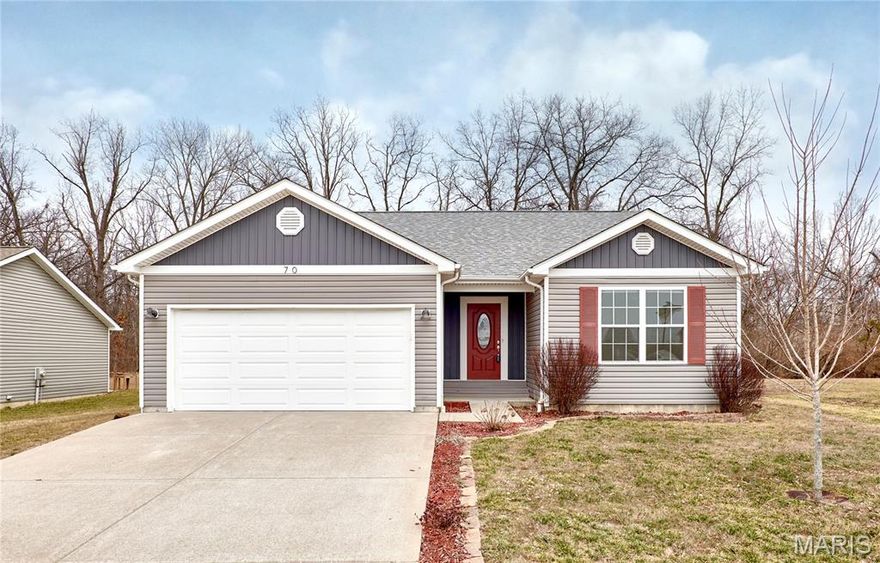 Beautifully maintained 3-bedroom, 2-bath ranch home built in 2017, located in a quiet neighborhood just outside Troy, MO and within the Troy School District. This inviting one-story home features warm hardwood flooring from the entry through the main living areas and a thoughtfully designed, open layout ideal for everyday living and entertaining.

The floor plan offers two guest bedrooms and a nicely finished hall bath near the front of the home, leading into a spacious living room that flows seamlessly into the dining area and kitchen. The kitchen is highlighted by granite countertops and opens to the dining area with access to the rear deck. A convenient main-floor laundry adds to the ease of one-level living.

The primary suite serves as a private retreat with a large walk-in closet featuring custom shelving and a private bath with a sleek frameless glass shower.

Step outside to the deck overlooking a large backyard backing to a wooded area, providing privacy and a peaceful setting—ideal for entertaining, relaxing, or watching wildlife. Located just a short drive from Cuivre River State Park, this home offers a rare combination of comfort, nature, and convenience.