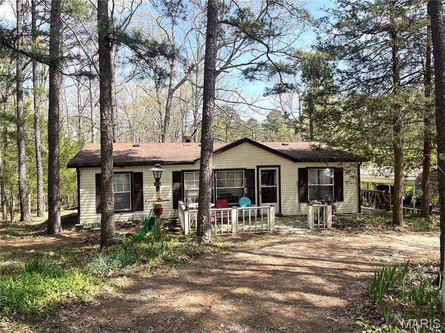 Very Motivated Sellers for this 3BR / 2BA manufactured home on 1.50 acres.  Peaceful, Shaded Lot with Pines and sits just off Highway 21.  Welcome home to this inviting single-level residence on a concrete foundation, set on 1.50 acres of mature pine trees and yard. The all-electric home features a cozy wood-burning fireplace, an updated HVAC (2022) and hot water heater (2022) for modern comfort, and a practical layout with three bedrooms and two full baths. Enjoy outdoor living on the concrete front porch and a private wood deck off the side — perfect for morning coffee or evening gatherings. A convenient circle drive and generous shade from established trees complete the package. There are separate sheds for your storage needs as well as a carport.  Make an offer today.
