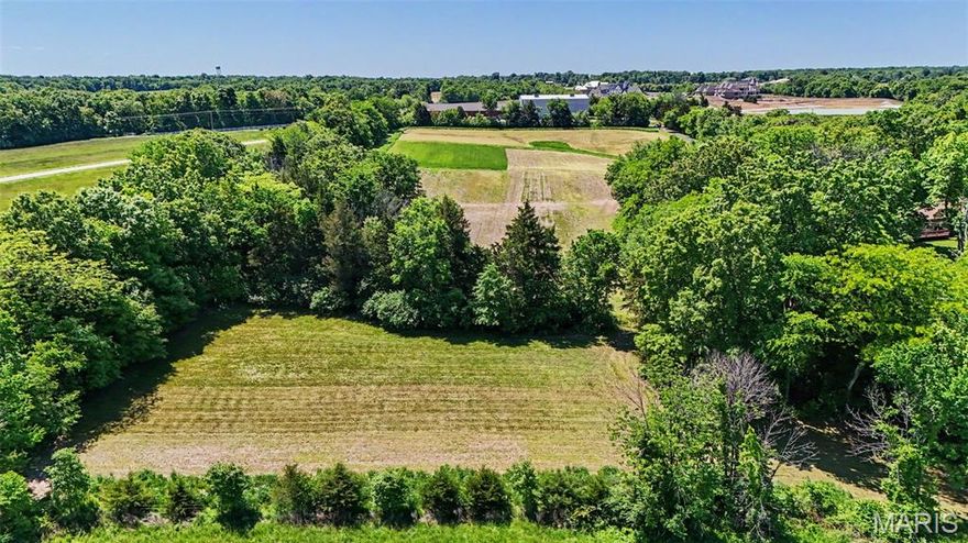 Discover the perfect blend of privacy, beauty, and convenience with this stunning 8.4 acre tract in Defiance. Mostly open and framed by tree-lined borders, this picturesque property offers beautiful views and the ideal setting for your future home, private estate, hobby farm, or equestrian retreat. With unrestricted acreage and plenty of usable ground, there's room for horses, livestock, gardens, outbuildings and more. Enjoy the peaceful country atmosphere while still being just minutes from Lake Saint Louis shopping, dining, and convenient Highway 40 access. Outdoor enthusiasts will love the close proximity to Broemmelsick Park and Busch Wildlife with miles of scenic hiking and riding trails, fishing and recreation, along with the local wineries and rolling countryside. Don't miss out on this exceptional property that offers the flexibility and lifestyle you've been searching for. Septic and Well Required. Electric fronts the property. Virtual tour is a concept of a home being built on the raw land . If desired: Dividing the property may be possible, but would require county approval of zoning change from ag to rural residential.