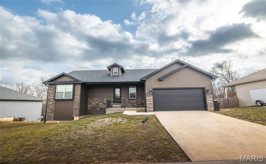 Stunning 5-bedroom, 3-bath ranch over a fully finished basement located in a highly sought-after subdivision! Built in 2023, this home truly offers all the bells and whistles with a modern open-concept floorplan designed for comfortable living and entertaining. The spacious kitchen features abundant cabinetry, a large island, stainless steel appliances, granite countertops, and an oversized pantry. The living room is filled with natural light and showcases beautiful vaulted ceilings, creating an airy, inviting space. The primary suite is a true retreat with coffered ceilings, recessed lighting, dual sinks, an oversized walk-in shower, and generous walk-in closets. An additional bedroom and full bath are conveniently located on the main level. Downstairs, you’ll find a huge family room, three additional bedrooms, and a full bathroom—perfect for guests, extended family, or extra living space. There is also unfinished space ideal for storage. Enjoy outdoor living with a covered front porch, covered deck, covered patio, and a fenced-in backyard. Conveniently located just 15 minutes from the front gate of Fort Leonard Wood, this home combines style, space, and location.