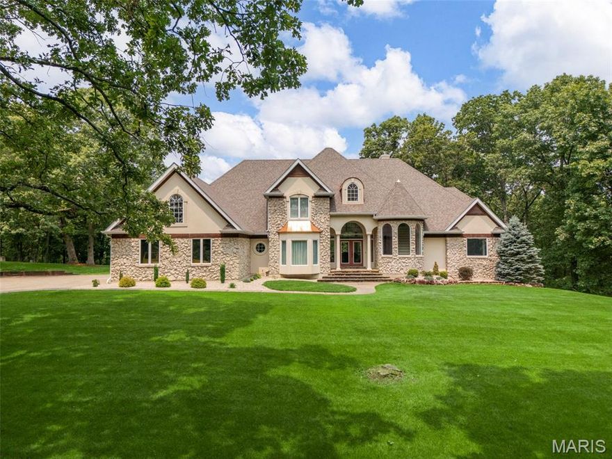 Discover the perfect blend of luxury, privacy, and outdoor living within this 18 acre custom built estate! Tucked into a wooded, park-like setting, this fabulous story and a half home overlooks your own 1.5-acre private lake, stocked for fishing and ready for paddle boarding and kayaking. This home features an inviting open floor plan centered around a soaring 2 story great room with an impressive window wall that fills the home with beautiful natural light. The elegant foyer greets you as you enter the home, the large kitchen overlooks the cozy hearth room and great room making entertaining and enjoying the views effortless. The main floor owner’s suite features a spacious luxury bath, private entrance to the deck and walk-in closets. The 2nd floor offers 3 more generously sized bedrooms a beautiful balcony overlooking the great room and 2 full baths. Enjoy evenings entertaining or relaxing on the expansive deck, perfectly positioned to take in sunsets over the water. The walkout lower level is designed for guests and recreation, complete with a 2nd kitchen, spacious rec area, bathroom & potential for a 5th bedroom. Car enthusiasts and hobbyists will love the convenience of the 2 car garage plus 40’ x 60’ insulated workshop which offers 3 more garage bays, 10' doors & concrete floors. All of this is less than 10 minutes from Hwy 70 & Hwy 61: offering peace and seclusion without sacrificing convenience. This is a rare opportunity to own a private lakefront retreat with room to live, work, and play! Must have lender preapproval. 
Virtual tour: https://vimeo.com/1176676298?share=copy&fl=cl&fe=ci