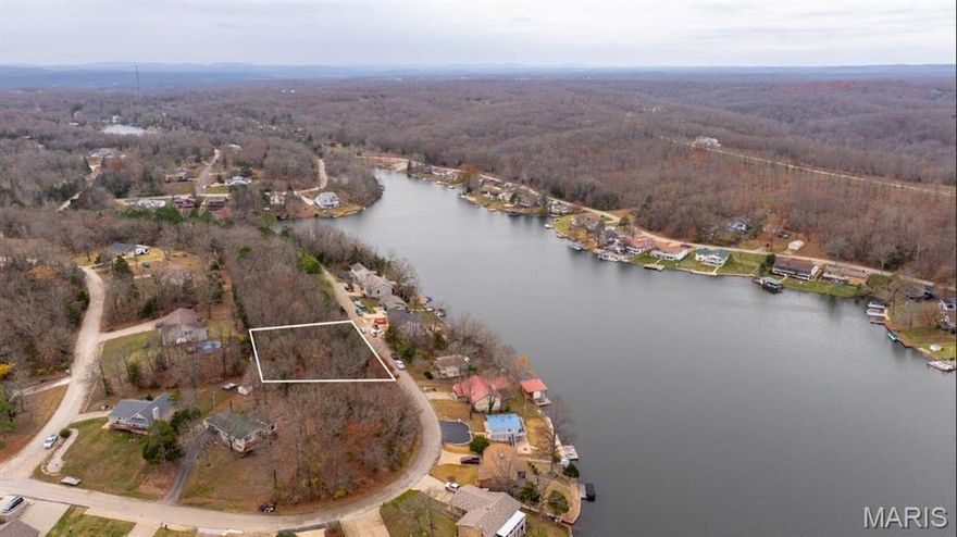 Beautiful lake view building lot directly across the street from Lac Carmel. This lot offers a western view of the lake for incredible sunsets. Lac Carmel is approximately 57 acres in size and is one of 16 lakes in Terre Du Lac. Terre Du Lac also offers many other amenities including swimming, boating, and golf.