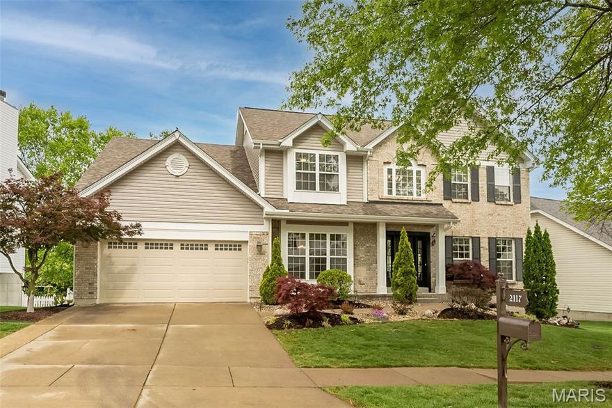 Welcome home to this beautifully updated 2 story home in Avalon Hills in the Rockwood School District. Step inside to an abundance of natural light, gorgeous maple hardwood floors, newly painted and an open floor plan perfect for modern living and entertaining.  The chef's kitchen features granite countertops, floor-to-ceiling cabinetry, a pantry with pull-out drawers, and premium appliances including a Viking stove and Wolf oven. New atrium doors open to a composite deck - perfect for morning coffee or hosting guests. The fully finished basement adds incredible versatility with a second kitchen, full bath, ample storage, and new atrium doors leading to a stamped concrete patio. Enjoy the covered patio overlooking a level, fully fenced backyard - ideal for play, pets, and outdoor gatherings. Upstairs, an elegant T-staircase leads to 4 spacious bedrooms and 3 full baths, including a jack-n-jill. A bonus loft offers the perfect flex space for a home office, playroom or a teen hangout. The primary suite is a true retreat with dual walk-in closets and a spa-like bath featuring a separate shower and jacuzzi tub. Major updates include a new roof, siding and screens (2025), new stairwell carpet, painted through-out, updated lighting, new atrium doors, new shutters and an expanded driveway. The 2-car garage offers bonus workshop space and the main-floor laundry with additional storage. Conveniently located near highways, shopping and restaurants. Checks everybox!