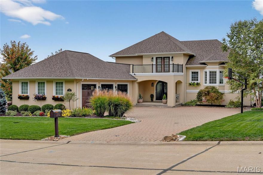 Stunning Curb Appeal in Custom Built Home with Soaring Views of Tapawingo! New Roof 2023. Impressive Paver Stone Driveway and 3 Car Craftsmen Garage Doors (new 2022) greet you upon arrival. Arched entry way w/ solid wood front door with glass inlay welcome you into first floor.  Main level with gleaming hardwood floors was extensively remodeled in 2023.  Chefs Dream Kitchen w/ Center Island, stainless steel appliances including six burner gas range & hood, and Cambria marble tops. Designer accents w/ ceramic tile backsplash and gold finish hardware. Floor plans flows into Fam Room with Gas Fireplace, book shelves, and beverage center. Dining Rm w/ plantation shutters and double door out to maintenance free composite deck.  Amazing Southwest views of the Golf course and beyond! “Raised” 1.5 story plan with Primary Bedroom just up from main level featuring tons of light and private balcony.  Large WIC as well. His & Her vanities with jet tub and glass encased shower in primary bath. Upstairs there are three beds for the family plus Rec Room all the new carpet (2023). Beds 2 &3 with Jack-n-Jill bath.  4th bed is guest suite. Perfect floor plan for the growing family. Walk out LL is finished with bed/office space and adjoining bedroom. Tons of extra storage space and tool area as well.  This one of a kind home will have you feeling like Sunset Hills is the Hollywood Hills!