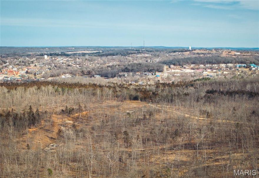 Tract 2- A rare opportunity awaits with this exceptional 70 +/- acre tract in a fantastic location near the heart of Potosi, MO, offering the perfect blend of privacy, natural beauty, and future potential. Featuring gently rolling terrain and multiple premium build sites, this property is ideal for those seeking a private estate, small development, or recreational retreat.

The land provides ample space for custom homes, or income-producing ventures, all while maintaining a peaceful, secluded setting. The front 5.26 acres lies within city limits along the right side of the road, adding convenience and flexibility for future use.

Electric service and other utilities are already available near the entrance. Whether you’re envisioning a homestead, investment opportunity, or weekend escape, this versatile tract is ready to bring your vision to life. Additional acreage available (Tract 1 - 86 +/- acres)