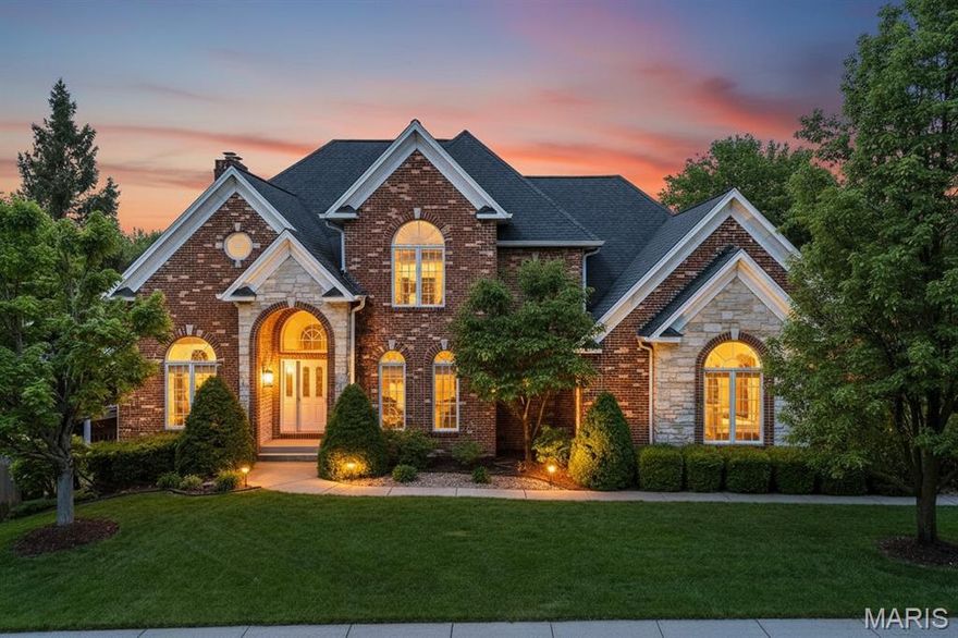 Welcome to Governors Place, one of St. Charles’ most prestigious enclaves—a refined retreat where a breathtaking canopy of mature trees and a quiet, park-like atmosphere set a serene tone. At 125 Gardner Place, you aren’t just buying a masterfully designed brick and stone estate; you’re claiming your place in this legendary community of character and distinction.
From the moment you pull into the drive, the commanding curb appeal and sophisticated pitched roofline make it clear you’ve arrived somewhere special. Step through the majestic stone-arched portico into a grand two-story foyer that sweeps you off your feet with soaring scale and radiant light. Just off the entrance, stately double-glass French doors reveal an inspiring home office sanctuary featuring impressive wall-to-wall built-ins.
Designed for an airy, connected lifestyle, the wide-open floor plan draws you into a sun-drenched living room of true "Great Room" scale. Anchored by a striking red brick fireplace and a massive bay window acting as a living portrait of your private backyard, this space flows seamlessly into the chef’s kitchen. A masterpiece of functional luxury, the kitchen boasts a rare double-island layout with glistening granite, double wall ovens, and rich cabinetry. Hosting is effortless with two high-end specialty zones: a cozy morning coffee station and a sophisticated beverage hub complete with a wine chiller and prep sink.
This transitions beautifully into the light-filled breakfast nook and a magnificent hearth room. Here, a floor-to-ceiling stone fireplace, flanked by custom built-ins, provides a sophisticated backdrop for bright Spring mornings as the budding tree-line offers a lush, private view. For more formal occasions, the elegant dining room—with its recessed tray ceiling and classic chandelier—offers a polished retreat where guests will want to linger.
Escape to the expansive primary retreat, a "Grand Suite" that easily accommodates a king-size bed and a private sitting area against a five-panel bay window with treetop views. The luxury continues through a stylish pocket door into the en-suite spa, featuring a deep corner garden tub and dual vanities. Organization becomes an art form in the boutique-style walk-in closet, featuring a sophisticated custom cabinetry system. With integrated wiring for sound, a wall-mounted TV niche, and "His & Hers" walk-in closets, this suite is the definition of tranquil, modern luxury.
Redefine "basement living" in the spectacular walk-out lower level. This high-energy retreat features a designer wet bar, an "old-world" wine cellar with a handcrafted cork mosaic wall, and a cozy lounge area offering a sophisticated retreat with another floor-to-ceiling stone fireplace. For movie buffs, a professional home theater with blue LED mood lighting and surround sound transports you straight into the action.
From its stunning architectural details to the sense of privacy found throughout Governors Place, 125 Gardner Place is so much more than just a house—it’s the lifestyle upgrade you’ve been waiting for. Don’t miss your chance to claim a piece of St. Charles history.
Ready to see it for yourself? Reach out today to schedule your private tour and experience the magic of this incredible estate in person!

Please note: Some photos in this listing have been virtually staged to showcase the home's potential.