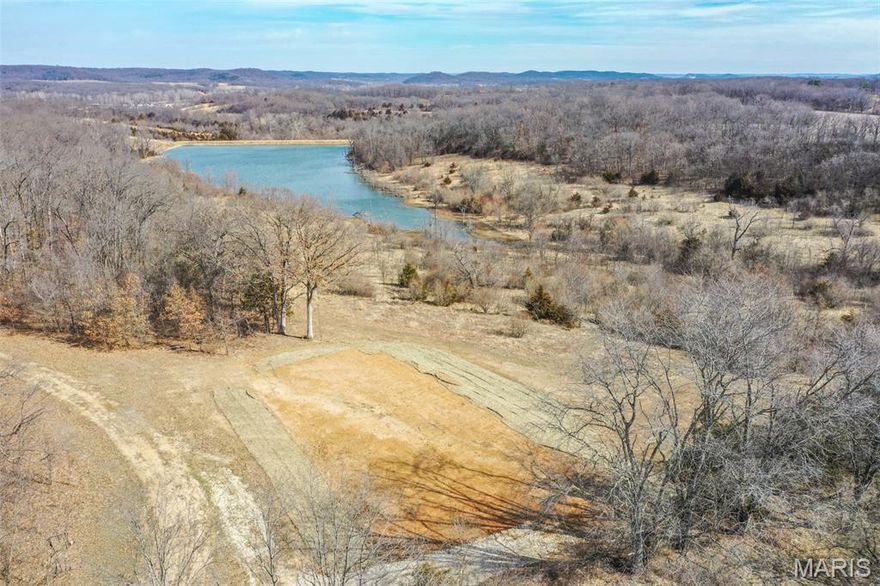This scenic farm checks every box for the serious outdoorsman and investor alike. Offering a strong combination of recreation, tillable acres with income, and build potential, this property is the total package.

The hunting is outstanding. With a diverse mix of habitat, natural cover, travel corridors, and food sources, this farm sets up perfectly for whitetail and turkey. The layout provides ideal stand and blind locations with strategic access to keep pressure low and success high. Whether you’re looking for a proven hunting property or a place to develop into a premier recreational tract, the foundation is here.

Approximately 18 acres are currently in row crop production, providing annual income while also serving as a valuable food source for wildlife. The blend of tillable ground and cover creates the kind of edge and transition zones that consistently produce quality deer movement.

A stunning 9± acre lake sits at the heart of the farm and is stocked with bass, bluegill, and catfish. Not only does it provide year-round fishing and recreation, but it also enhances the property’s wildlife appeal and overall value. Imagine early mornings in the stand and evenings casting a line as the sun sets over the water.

Multiple build sites offer incredible views overlooking the lake and surrounding countryside. Whether you’re planning a forever home, hunting cabin, or weekend getaway, the setting delivers privacy, scenery, and convenience. The location offers easy access while maintaining the seclusion buyers are searching for.

Properties that combine strong hunting, income-producing tillable acreage, a large stocked lake, and premium build sites in a great location are hard to find. This is an opportunity to own a well-rounded farm with both immediate enjoyment and long-term potential