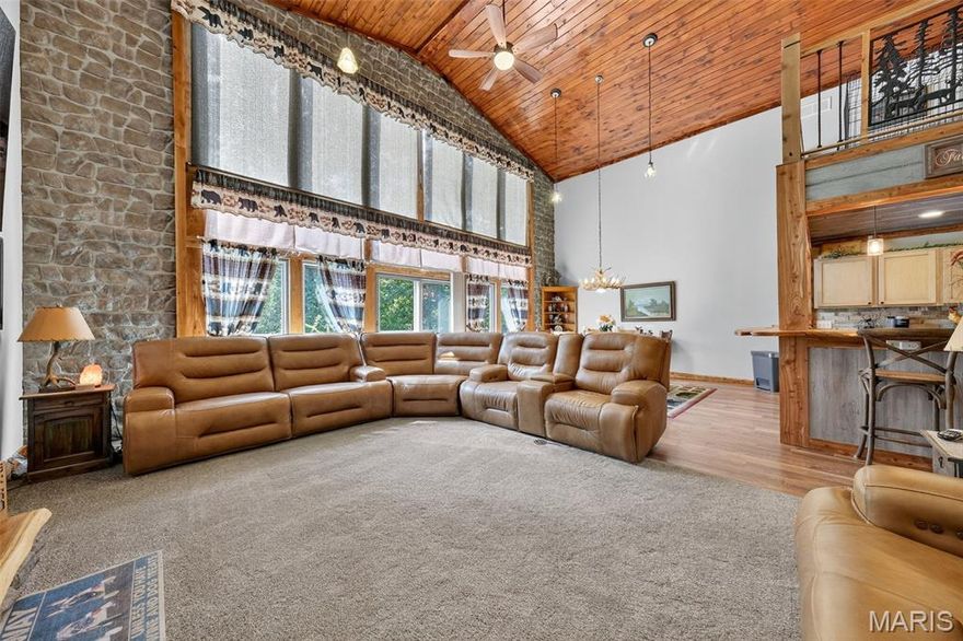 Welcome to your dream retreat! 

This stunning three-bedroom, two-bath custom home is nestled on 15 acres, offering breathtaking views every day all while maintaining privacy. Designed with comfort and style in mind, this home features an open and air layout that seamlessly connects you to nature.

Enjoy spacious living with a Living room leading to a maintenance free deck overlooking an incredible wooded  creek bottom for endless nature viewing!  The loft, master bedroom and master bathroom complete the second floor overlooking the living room, dining room, and an incredible view out renewal by Andersen Fibrex windows, ensuring energy efficiency and durability. 

The property boasts a two-car garage, providing ample space for vehicles and storage with 16-foot basement walls, heated by a large wood stove.  creating endless possibilities for customization—whether you're envisioning a workshop, additional living space, or a hobby area!

 Additionally, the home has been inspected by Chesterfield Service, providing peace of mind for your future investment.  

make your way out to the pool complete with a deck for entertaining, and concrete pad for your fire pit!

Escape to tranquility with these incredible surroundings and make this beautiful property your new sanctuary!