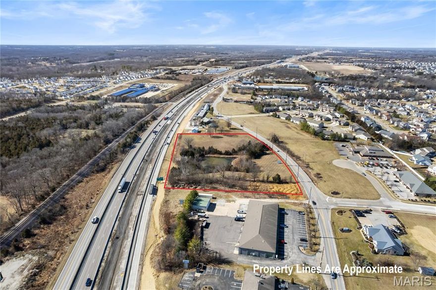 Prime vacant land opportunity with electric, public water, public sewer and gas available at the road and direct highway frontage on Interstate 70. Currently zoned for high-density residential use, this property offers exceptional flexibility with potential for office development, indoor storage, retail, or commercial use. The master plan designates the site for commercial development, making it an outstanding investment opportunity for builders, developers, or business owners looking to capitalize on future growth. Excellent visibility, strong traffic exposure, and convenient access.