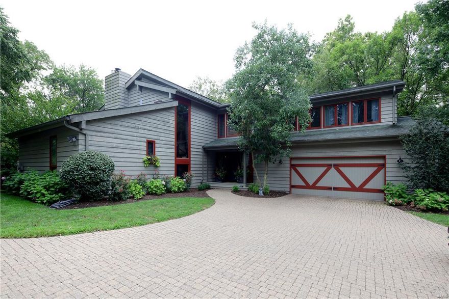 Situated on 2+ private, park-like acres, this 4 bedroom, 4.5 bath home is the perfect blend of character and sophistication.  Designed with the outdoors in mind, the entry leads you to the 2-story great room with a slate tile fireplace and floor-to-ceiling custom bookcases with a wall of windows and doors that opens to an expansive deck and lush backyard.  Spacious master suite with updated bathroom, updated kitchen with all the must haves, large dining room, powder room, and laundry/mudroom complete the first floor.  Upstairs are 3 spacious bedrooms, 2 full baths and sitting area. The true walk-out lower level consists of media room, recreation room, full bath and wonderful storage area with built-ins.  This home has incredible views from every window and lot can easily accommodate a pool/pool house.  2-car garage.  You will surely be impressed by the list of updates! Additional Rooms: Mud Room