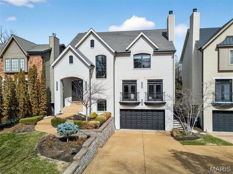 Step into luxury in this beautiful 2004 four-bedroom, four-and-a-half-bathroom University City home. From the moment you enter, you’ll know you’ve arrived somewhere special. The open living space, soaring ceilings, rich hardwood floors, and elegant dining area create an immediate impression. Just off the entrance, the inviting great room features a gas fireplace and oversized windows, making it the perfect place to relax. As you move into the hearth room, you’ll find yet another gas fireplace—ideal for cozy gatherings. The spacious kitchen offers ample room for cooking and dining, and French doors lead to a beautiful deck overlooking a generously sized backyard and stunning pool oasis. A wet bar and powder room complete the main level. Upstairs, the primary suite is a true retreat, featuring a large closet with custom shelving and a spa-like en suite bathroom with both a soaking tub and a separate shower. Three additional bedrooms and two full bathrooms, including a Jack-and-Jill suite, offer flexible space for family, guests, or a home office. A conveniently located upstairs washer and dryer hookup makes everyday living even easier. The basement offers flexible space for a home gym, entertainment area, or pool prep zone, along with an additional washer and dryer hookup and full bathroom. Step outside to enjoy the patio - perfect for summer barbecues and hosting pool parties. With recessed lighting throughout, built-in speakers, a two-car garage, and just a two-minute drive to Clayton, this home truly has it all.