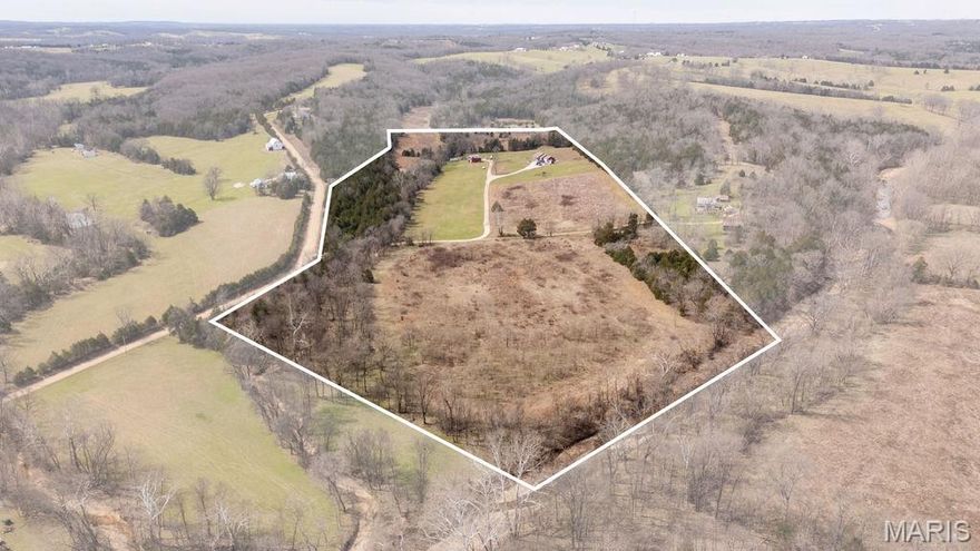 Built in 2020 and located just outside of Linn, Missouri, within the Linn School District, this beautiful 3 bed, 2 bath home offers just over 2,008 square feet of thoughtfully designed living space on 42 +/- acres of a perfect blend of flat creek bottom and gently rolling Osage County hills. Constructed with efficiency and quality in mind, the home features 2"x6" exterior walls with spray foam insulation, a fully spray-foamed ceiling, and an air-to-air heat pump with a backup gas furnace for year-round comfort. Inside, you’ll find knotty hickory cabinetry paired with granite countertops throughout, a spacious, oversized laundry room with a custom folding and sorting table, and a central vacuum system for convenience. The kitchen is equipped with a Vent-A-Hood range featuring the “Magic Lung” system for quiet, highly efficient ventilation, while a tankless water heater ensures a steady supply of hot water. The living room offers a cozy gas fireplace, while the primary suite includes an electric fireplace and a stunning 9 foot, live-edge walnut vanity top for a truly custom touch. All appliances will convey with the home, with the exception of the washer and dryer.

Outside, the property is just as impressive. With approximately 70% open ground and 30% timber, the land is well-suited for a variety of uses, including livestock, horses, or recreation. The east boundary is formed by Contrary Creek, adding both beauty and functionality, while the mix of timber and open fields creates an ideal habitat for abundant wildlife. A 40’x30’ exterior pole barn provides excellent storage or workspace, with electric already in place and water conveniently nearby. This property is located in the Linn School District and sits less than 15 minutes from town, 35 minutes from Jefferson City, 30 minutes from Owensville, and 45 minutes from Hermann—offering a great balance of rural privacy with convenient access to nearby communities. Located in an area known for managing quality deer, the property offers multiple food plot and stand locations already in place. Whether you’re looking for a turnkey country home, a hunting property, or a versatile farm with room to grow, this one checks all the boxes in a highly desirable setting.