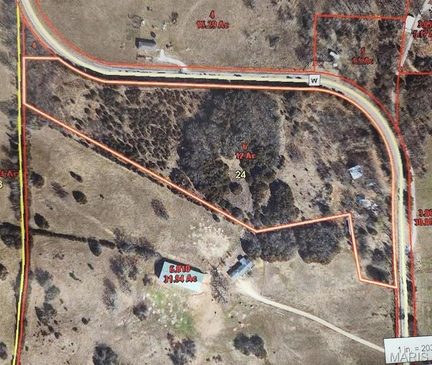 12 Acres located on State Highway just 12 miles from Marshfield. Paved road. .Useable 23x24 1 Car garage ,  Great 1320 sq. ft.  Barn with additional open 9x6 lean to.    Vacant land approximately 90% open. Great location for your new home or manufactured home. Electric available   Marshfield school. A great find!