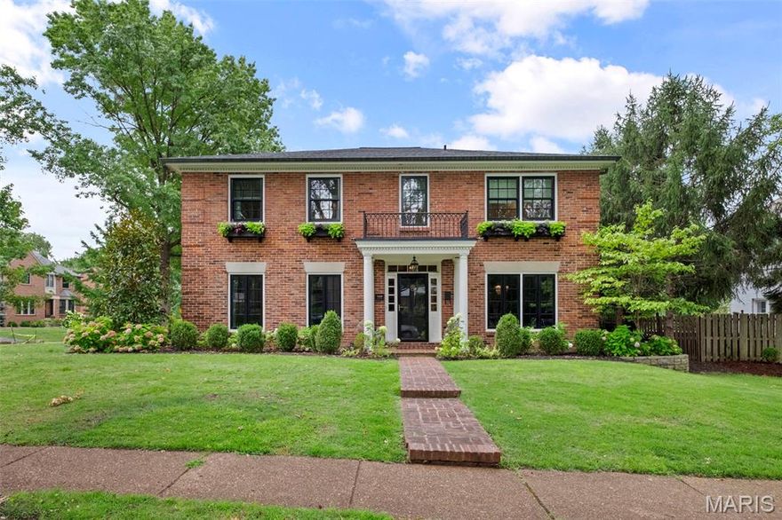 Welcome to this beautiful brick colonial nestled in the Moorlands. Situated on a corner, the home has a great size lot, fully fenced rear yard, spacious attached garage, sportcourt, & excellent patios, all of that before you go inside! A center hall welcomes you with a wonderful gathering room on your left and lovely dining room on your right. You will notice the gleaming hardwood floors, charming wainscoating, portrait molding, and millwork. The gathering is a great spot to relax with a book or cuddle up for a movie with the family. Beyond is a handsome living room with built-in shelving, dry bar, and fireplace, fantastic for entertaining or everyday use. Finally, the newer, gorgeous kitchen! White cabinetry, marble counters, stainless appliances, great center island, eat-in space - overall a terrific place to cook! Also on the main floor, a mudroom with cubbies & main floor laundry - such a great find. Upstairs there are 3 good-size secondary bedrooms with significant closet space, a full hall bath & an amazing primary. The primary is a generous size and has a walk-in closet and pretty ensuite bath that offers a double vanity and generous shower. The spacious finished lower level has a recreation space, a great office, and half bath. Upgraded windows, doors, roof, and new sprinkler system. Walkable to everything Wydown has to offer plus schools, parks, and so much more, the location is unbeatable!