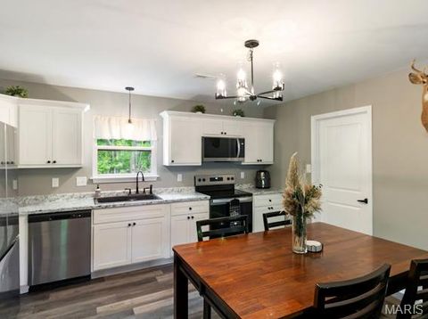 Tiny photo for 400 East Plattin Street, De Soto, MO 63020 (MLS # 26028855)