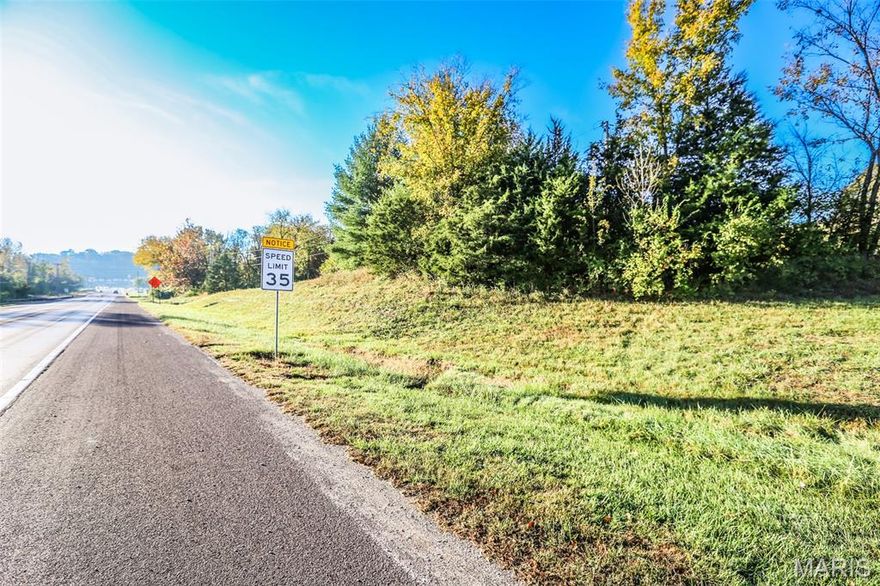 Fantastic Commercial Opportunity! Take advantage of nearly 400 feet of prime highway frontage with this level lot, perfectly positioned for maximum visibility and convenience. Zoned NC-1 (Neighborhood Commercial), this property offers incredible potential for a wide range of business uses. Located just a short walk from the high-traffic intersection of Hwy 30 and Hwy W, this site ensures excellent exposure and accessibility. Public water and sewer are available, making development straightforward and cost-effective. Whether you’re looking to establish, expand, or relocate your business, this property’s unbeatable highway/interstate frontage makes it a must-see. Property is vacant land and being sold as-is.