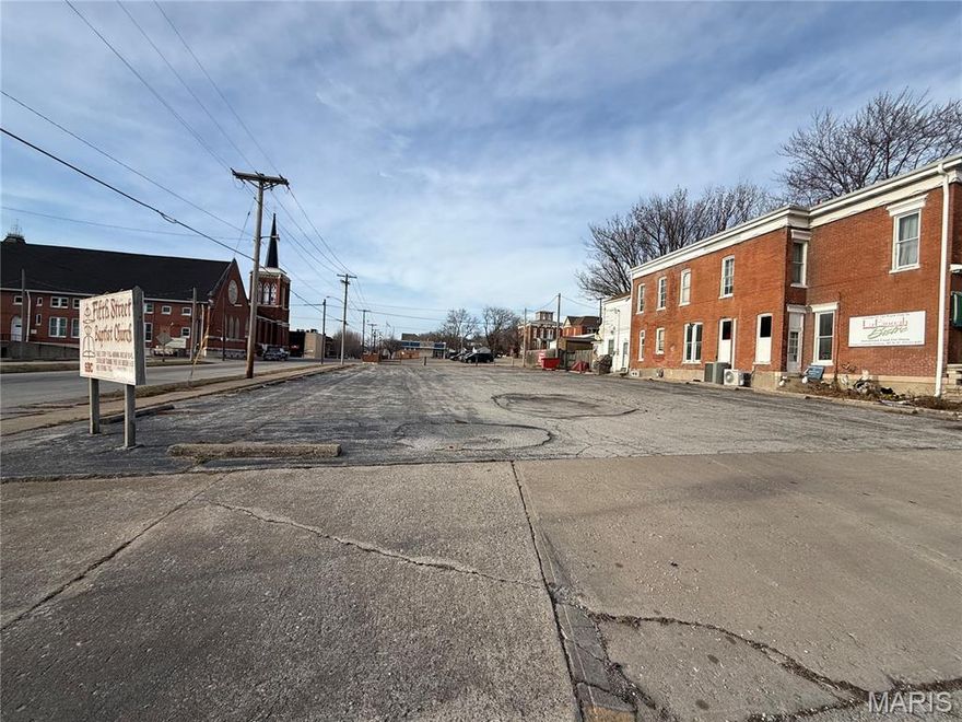 Commercial lot located in downtown Hannibal. Lot is on the corner of 5th Street and Center Street. The lot currently has 27 parking spots. Lot has two entrances/exits. Located next to Central Park and a few blocks from the Mississppi River and downtown.
Lot could be use for residential, multi-family, or commercial.
