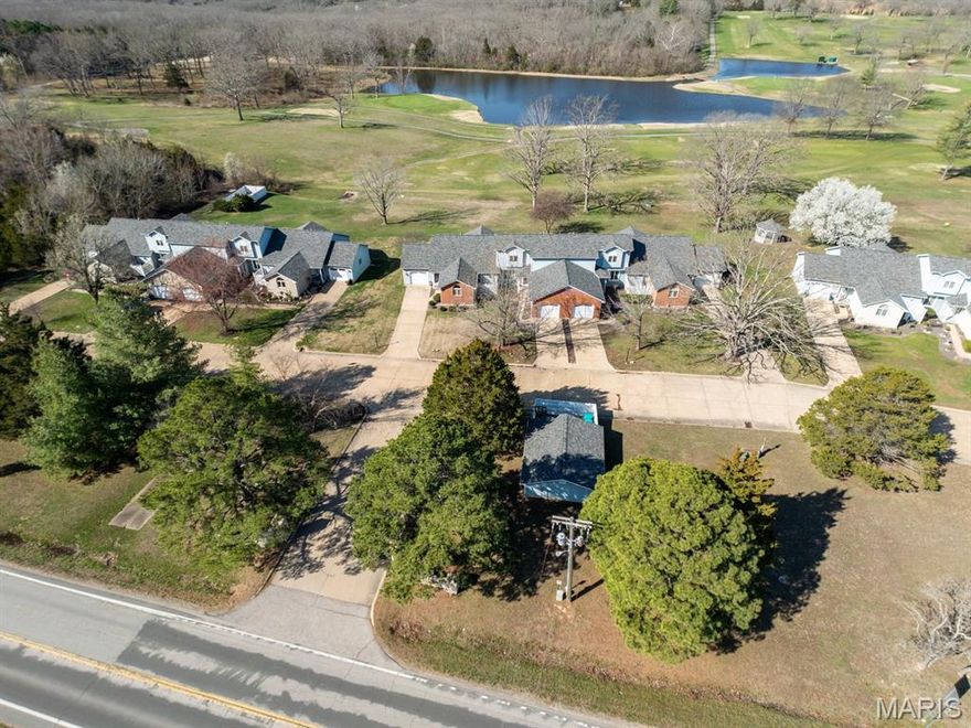 GOT GOLF??? This esquite Condo is overlooking the sparkling Lake and the Golf Course allowing for critiquing the golfers, cool evening breezes to give a spectacular sunset where you will see the Deer come out to graze on manicured greens.  It is a breathtaking view from the covered back deck and the house through the window in the master to the French Doors in the living room.  This delightfully decorated Condo has 3 large bedrooms and 2 baths.  A handy finished garage goes immediately into the this well equipped kitchen with a Breakfast nook.  On to the living room overlooking the Golf Course too then to a pleasantly selfish Master Suite with access to the Covered Deck, Walk-in Closet and the Bathroom + laundry room too it's just easy living.  There is also a Dining Room area between the kitchen and Living Room for those celebration times.  Upstairs, you will find 2 nice big bedroom and a full bath.  This Condo is so well developed and the grounds are beautiful with meandering concrete paths to easy walk viewing the delightful landscape. This is ease living with the Association attending to just about everything on the outside.  Water and Sewage is also included in the month dues.  Wonderful neighbors await to greet you, come on and take a peek, this will not last forever.