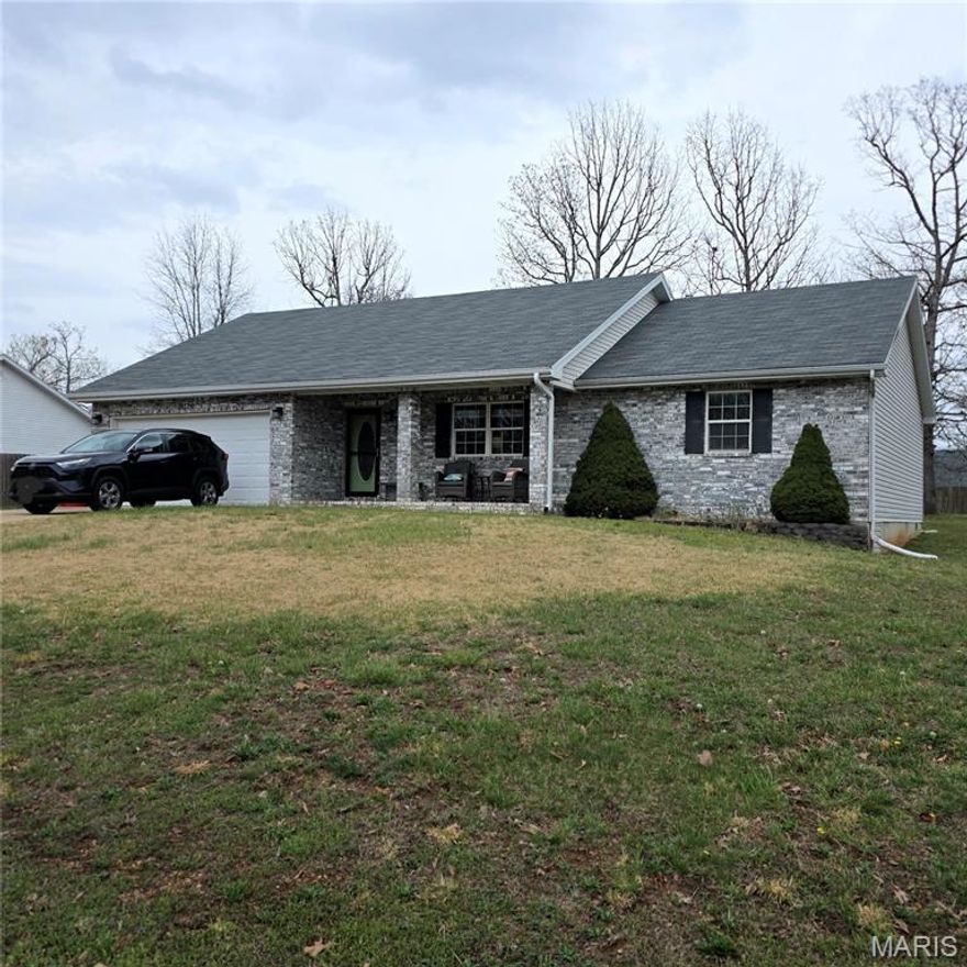 Located just minutes from Fort Leonard Wood in a highly sought-after area of Waynesville, this well-maintained 3-bedroom, 2-bathroom home offers the added bonus of a built-in storm shelter and the ease of single-level living. Inside, you will find durable vinyl flooring throughout and an updated kitchen with new hardware and a water filtration system, blending functionality with modern touches. Major improvements provide peace of mind, including a newer roof approximately 1 year old, HVAC replaced in 2022, and a vapor barrier in the crawl space for added long-term protection.
The 2-car garage is a standout feature with an epoxy-coated floor and a built-in storm shelter by F5 Storm Shelters, a Missouri-based manufacturer known for tornado safety systems. The shelter accommodates 4 to 6 people and includes ventilation, viewing windows, and a secure locking system.
Enjoy outdoor living with a composite back deck and partial pergola, perfect for relaxing or entertaining. The flat yard offers easy maintenance, and the shed provides additional storage with loft space above. Exterior upgrades include updated lighting fixtures and a leaf guard gutter system on the front of the home for added convenience and curb appeal.
Located outside city limits, this property offers added flexibility with No HOA, all public utilities, and scenic views while still being close to town and the Fort Leonard Wood Military Installation. Schedule your showing today!