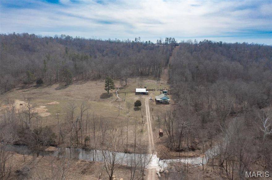 Welcome to the Koola Koola Ranch! Located 9 miles east of Fredericktown and just a quarter mile from Amidon Memorial Conservation Area. This 16.5 acre farm is primed for the buyer looking for a turn key operation!  Approximately half cleared with good fence, 2 springs, water hole, and 600' of Cape Creek frontage. 1200 sq. ft. 2 bed, 2bath home with wrap around porch could stand to have  few updates but appears in good structural condition. Small work shop, goat stalls, barn, machine shed and chicken coop, all in working order. Seller says, they prefer a turn key sale. Tractors, live stock, tools and all. That's right, Zorro the goat, Romeo the bull, his harem, the pony and half a dozen rooster if they survive Sunday dinner between now and closing could be yours!