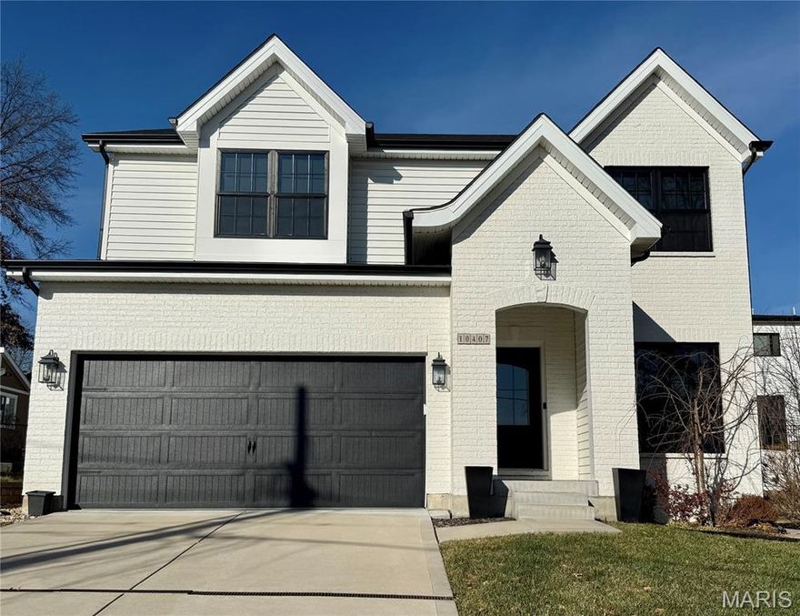 Step into modern luxury with this custom-built 2021 gem, located in the prestigious heart of Frontenac. Designed for both style and functionality, this 4-bedroom, 3.5-bath home delivers an open-concept layout that’s ideal for today’s living.?From the moment you walk in, you’re greeted by 9 foot ceilings, a dedicated office/sitting room with herringbone engineered hardwood flooring, built-in shelving and Anthropology chandelier. As you walk towards the main living area, enjoy the continuity of wide-plank engineered hardwood flooring, gorgeous custom wallpaper and half-bath with pedestal sink and pocket door. The main living area impresses with black modern Anderson windows that bathe the space in natural light, a tile-surround gas fireplace, wooden mantel, recessed lighting and custom automatic blinds. The centerpiece of the gourmet kitchen is a striking granite waterfall island complemented by sleek GE Cafe appliances, to include a double oven, 5-burner gas range with vented SS hood, built-in microwave and SS refrigerator (it stays!). The custom cabinetry, walk-in pantry and light fixtures from Metro Lighting add to the ease, flow and elevated style of the space. Upstairs, you’ll find the convenience of a second-floor laundry room alongside two generously sized secondary bedrooms with custom walk-in closets, full bathroom and the exceptional primary suite with coffered ceilings. The en-suite is a retreat of it’s own with Bain Ultra air-jet tub, separate shower, double vanities and private commode. The custom closet is accessible from the bedroom and the bathroom. The lower level is a showstopper in itself, featuring finished recreational space with Anderson Tuftex carpeting, built-in shelving, play space under the stairwell, a fourth bedroom, a full bathroom, storage space and a water softener. Outside, the fenced rear yard with paver patio is a delightful retreat to entertain or relax. The irrigation system is even complete with a rain sensor to prevent needless watering.?Every detail, from the upgraded modern finishes to the thoughtful floor plan, reflects exceptional craftsmanship by the The Manlin Company. This is more than a house—it’s a place to call home. Don’t miss your chance to experience unparalleled comfort, style and convenience in the Ladue school district.