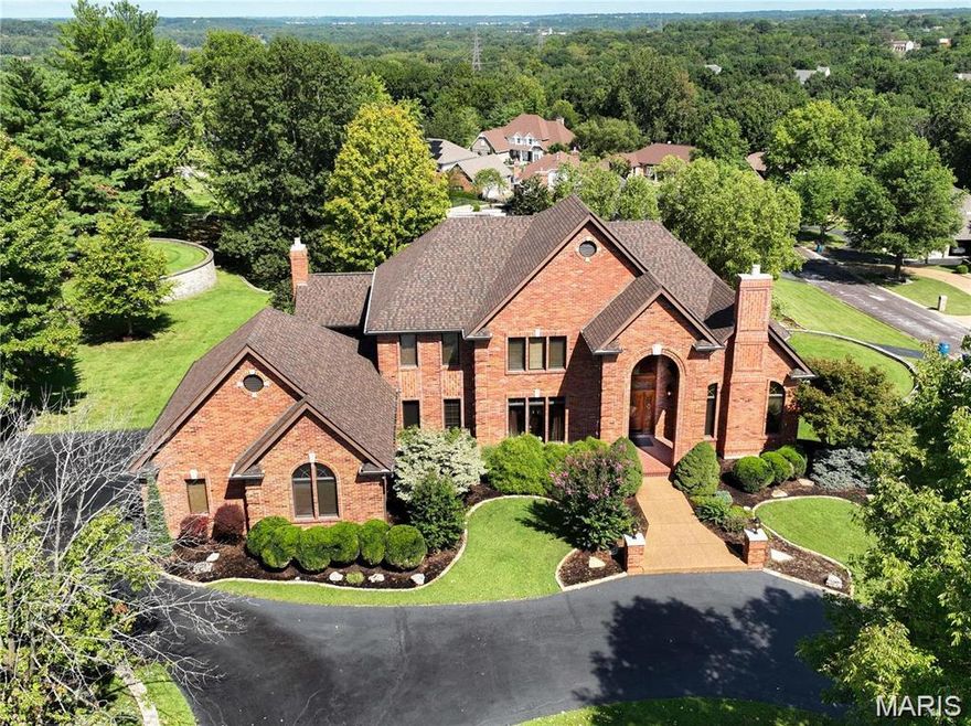 Pending. Welcome to 13525 Pine Wood Trail, a custom 2-story brick haven nestled on .83 acres in St. Louis. This exquisite home boasts four bedrooms and five bathrooms, perfect for families and discerning buyers seeking a blend of luxury and comfort. Step onto marble floors and admire the sweeping staircase that leads to an amazing view from the second-floor foyer. Entertain in style with a formal dining room, complemented by original features and elegant crown molding. The home's timeless character is enriched by a cozy gas fireplace and a butler's pantry for your finest culinary creations. The Tuscan-style kitchen, featuring custom cabinetry, is the heart of this home, while the full wet bar and built-in bookcases add a touch of sophistication. The main floor master suite promises a tranquil retreat, while the lower level walk-out expands your living space, complete with a 21-seat home movie theatre, pool table, fitness center and home office. This house is an extraordinary place to call home.