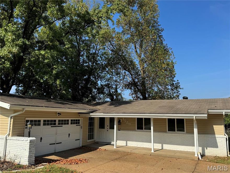 Don’t miss this beautifully remodeled 3-bedroom, 2-bath ranch home! The spacious kitchen is a true showpiece, featuring stainless steel appliances, 42-inch soft-close cabinets, a custom walk-in pantry door, and granite countertops that pair perfectly with subway tile backsplashes and window sills. Designed for gatherings, the open floor plan boasts soaring ceilings, LED can lighting, and plenty of room to entertain. The living room centers around a stunning shiplap fireplace with a high-efficiency insert and a one-of-a-kind mantle, crafted from a single 125-year-old Missouri white oak barn beam. Retreat to the master suite, where a spa-inspired bath awaits with double sinks and a custom modern shower. Every detail has been thoughtfully updated, including new electrical wiring, outlets, central heating/air conditioner, hot water heater, fence and gutter guards all less than 5 years old.