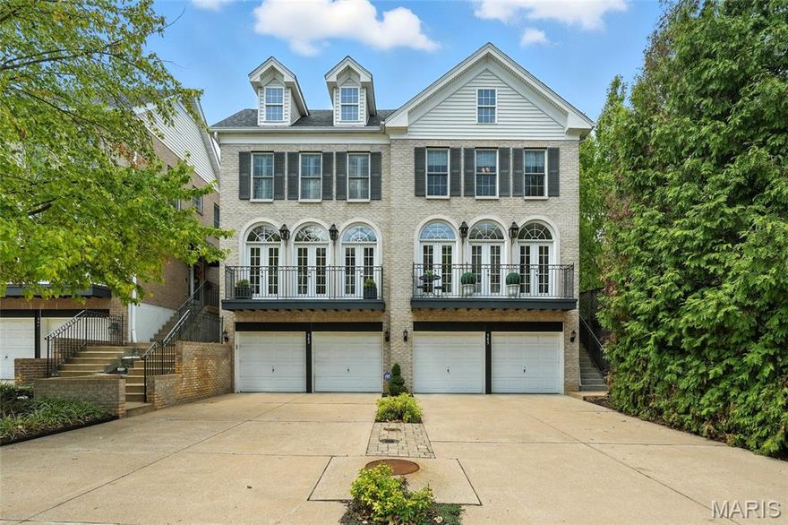 Enjoy sophisticated living in this upscale townhouse steps from downtown Clayton! Impressive architectural details like arched entries, elegant moldings and trim, wood floors, tall ceilings, coffered ceilings, expansive bay window, and the spectacular bank of French doors with arched transoms leading to a balcony. Updates include chef’s kitchen with custom cabinetry, granite counters, center island, stainless appliances, gas cooktop; baths, HVAC, roof, fabulous maintenance free deck and front balcony. Primary suite with coffered ceilings, 2 walk-in closets, and updated luxury bath. Finished lower level family or 4th bedroom and full bath. This property does have an area where an elevator can be placed to cover all 3 levels. Walk to Starbucks, restaurants, and shops in this prime location!