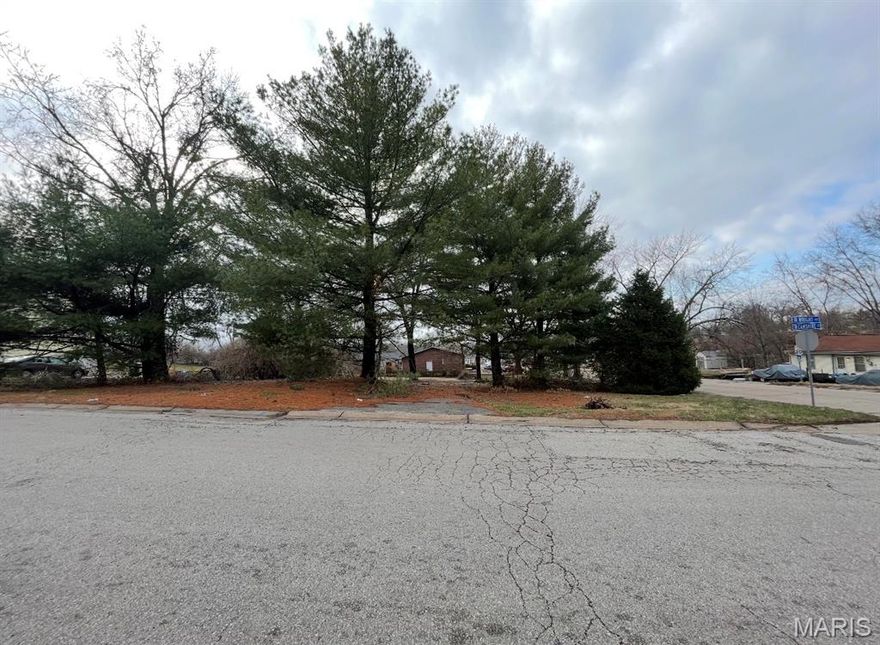 Great corner lot available in Ritenour School District. The previous home was destroyed by fire.  It was a 3 bedroom, 1 bathroom home with just under 1000 sq. feet.  This .33 acre lot is right near St Ann Golf Course, a few parks, and the St Ann Community Center. Build your dream home from scratch on this awesome piece of land.