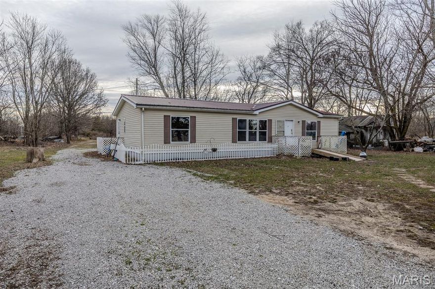 Located just north of Lebanon and minutes from Camdenton and Lake of the Ozarks, this 3 bedroom, 2 bath home sits on approximately 4.5 acres in a peaceful rural setting outside city limits. With a single-level layout, central heat and air, and a metal roof already in place, this property offers an affordable opportunity for buyers looking for space, privacy, and potential.

The land is open and usable, making it ideal for horses, a hobby farm, gardening, or anyone wanting room to spread out without breaking the budget. The long gravel drive creates separation from the road while still offering convenient access to both Lebanon and Camdenton.

Whether you’re a first-time buyer exploring government loan options, someone looking for an affordable place to make your own, or an investor searching for acreage with upside, this property checks a lot of boxes. Hard-to-find small acreage in this location and price range continues to draw attention, especially for buyers wanting country living with access to town and the lake area nearby.
