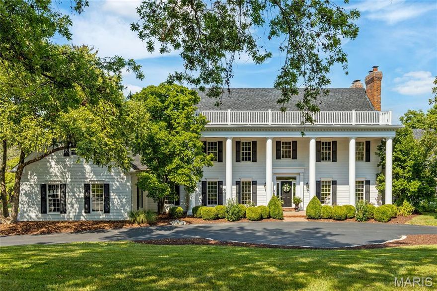 This spectacular lakefront Southern Colonial features 5155 sf of living space enhanced by distinctive design elements & extensive updates throughout. Impressive 2-sty foyer leads to formal living room with quartz fireplace, elegant dining room & library-paneled family room with box beam ceiling, wet bar, floor-to-ceiling fireplace flanked by built-in bookcases & bank of windows. Designer kitchen with quartz countertops, white cabinetry, stainless steel appliances & 6’ center island adjoins light-filled breakfast room with sliding glass door to private deck. Coffered primary bedroom suite combines the enjoyment of a brick fireplace with luxury bath with freestanding tub & adjacent study with wide bay window & wall of bookcases. Front & rear staircases access 4 additional bedrooms & 2 full baths. Walk-out Lower Level includes recreation room with 4th fireplace & wet bar, game room & full bath. Situated on a premium 1-acre lot with screened porch, 2 decks, circular drive & 3-car garage.