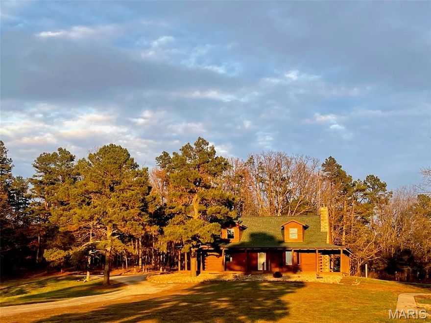 LOG HOME ON 80 ACRES W/LAKE:
Secluded 80-acre property located just minutes form Fredericktown. This well-maintained log home offers 3 bedrooms, 2 bathrooms and a wraparound porch with expansive views. Recent updates include a new roof and brand-new outdoor wood furnace.
Additional features include central heat and air, as well as a beautiful wood-burning fireplace in the living room.
The land consists of both pasture and timber, providing strong hunting opportunities and versatile use for livestock or recreation. The property includes a lake and a pond for fishing, with a camper hook-up near the lake for camping or guest.
Outbuilds include a barn, chicken house, and an additional structure suitable for animals, storage, or equipment.
This property offers a rare combination of privacy, usable acreage, and a close proximity to town. This property is ideal for a homestead, hunting retreat, or rural residence.