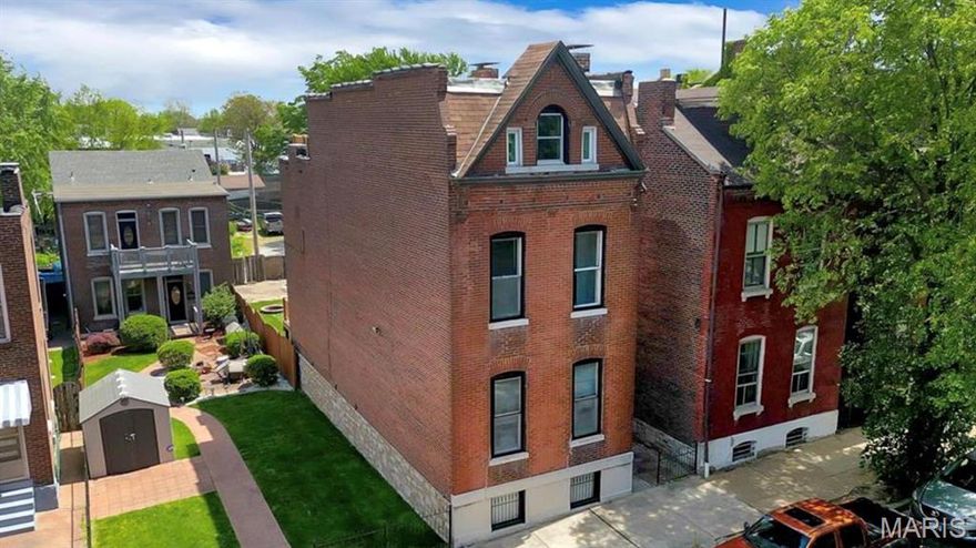 Step into a stunning blend of modern luxury and historic charm in this captivating Benton Park home. Every detail has been thoughtfully curated—from custom-designed cabinetry and striking waterfall edge marble countertops, to original pine floors and rich woodwork that showcase timeless craftsmanship. The elegant lighting adds a touch of sophistication throughout. The heart of the home invites connection, whether you're hosting lively gatherings or enjoying a quiet evening at home. A spectacular third-floor retreat offers the ultimate versatility—perfect as a fourth bedroom, media room, or lounge—complete with access to a rooftop terrace showcasing incredible city and Arch views you won't believe. 

The main floor features a beautifully updated bathroom, along with expansive living and dining areas highlighted by soaring 10-foot ceilings. Upstairs, retreat to a luxurious primary suite complete with a modern ensuite and an oversized walk-in closet. You'll also find a cozy reading nook, dedicated office or study space, and a generously sized third bedroom. So much versatile space in this beauty!

The third-floor retreat is truly a showstopper—offering endless possibilities as a fourth bedroom, family room, or private escape. From here, step onto your rooftop terrace and take in breathtaking views of the city and the iconic Arch. 

Perfectly located near cafes, restaurants, parks and impeccably designed, this one-of-a-kind home offers the best of style, comfort, and convenience—an exceptional opportunity to own a spectacular piece of Benton Park. 

New roof 2026, new HVAC, some refinished floors, updated kitchen & bathrooms, & smart technology.