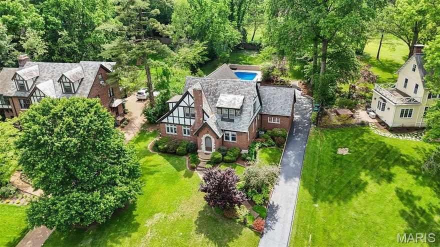 PUBLIC OPEN HOUSE CANCELED Nestled in the desirable Webster Park subdivision, this classic Tudor Revival blends historic charm with modern updates. Character-rich details include convex leaded glass windows, a slate roof, Saltillo-style tile floors, and an arts & crafts fireplace. Thoughtful additions create an open, updated feel throughout. The main floor features a spacious kitchen, dining room, sunroom/office, living and family rooms with walk-out to a brick patio—ideal for entertaining. Upstairs offers 3 large bedrooms, including a stunning primary suite with a custom walk-in closet and spa-like en-suite with jetted tub. Enjoy a beautifully landscaped front yard and a secluded backyard oasis with a private in-ground pool featuring a new liner. Finished lower level includes a full bath and versatile living space. Attached 2-car garage. Convenient to the best of Webster Groves. Don't miss your chance to own this piece of Webster history, nestled in the always desirable and rarely available Webster Park.