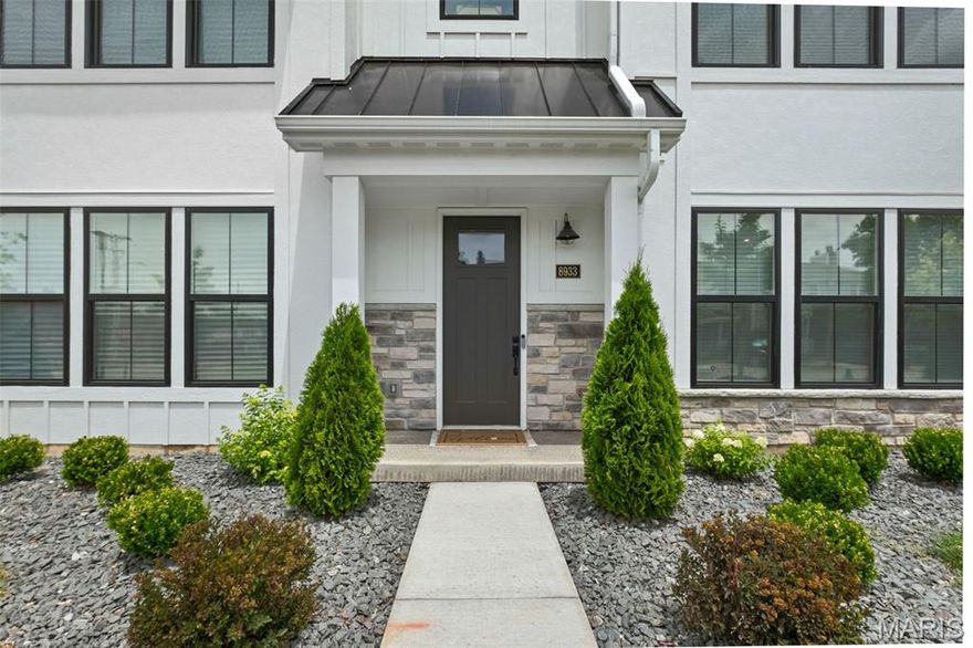 Skip the new construction wait! This 3yo Clifton floorplan townhouse in Gateway Heights is ready for its new owner! Completed in July 2023, this home features 3 spacious levels of living space w/ a rear entry 2 car garage. Inside you are greeted w/ high-end finishes throughout including tall ceilings, luxury vinyl plank flooring, custom window shades & neutral paint. The main level boasts an open-concept floor plan w/ a living room w/ electric fireplace, dining room, kitchen, flex/office space, half bath & deck. The spectacular chef's kitchen showcases a 12' island, quartz countertops, 42" soft-close cabinetry w/ crown molding, contrasting navy island, ss appliances & large pantry. Retreat upstairs to the primary suite w/ a private bathroom w/ a walk-in shower, dual sinks, ceramic tile & walk-in closet w/ custom shelving. The upper level is completed w/ a 2nd & 3rd bedroom, full bath & laundry room. The ground floor has a 4th bedroom & full bath.