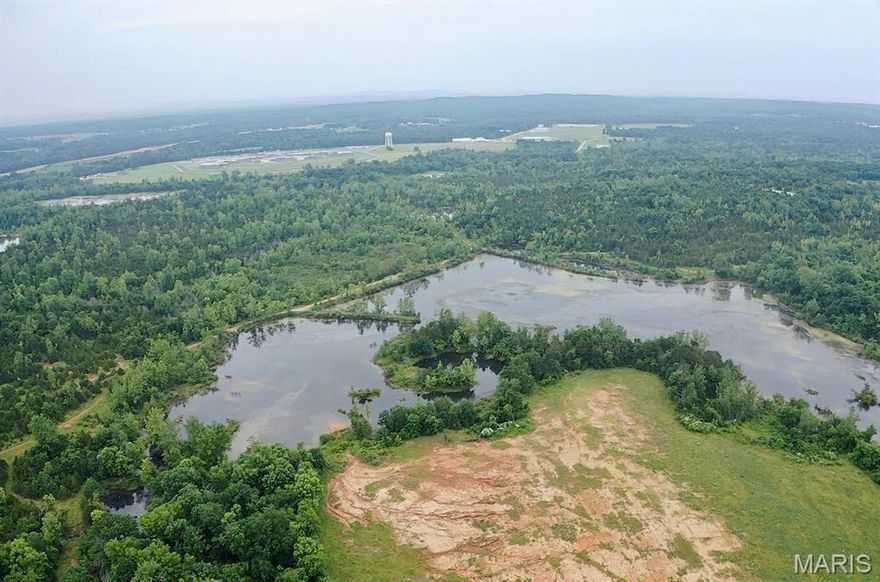 Discover a rare and expansive opportunity just 5 minutes from downtown Potosi! This large, unrestricted parcel offers a versatile blend of open pasture and hay fields, mature timber, recreational land, and a breathtaking private lake spanning over 20 acres. With approximately 40+/- acres of open ground, the property is ideal for farming, custom home building, development, or outdoor recreation. The large easternmost field is currently used for hay production, while the wooded section along the road has strong potential to be cleared and returned to pasture. The southeastern portion, lying below the lake dam and access road, is perfect for recreational use—think camping, hiking, or simply enjoying nature. The northern and southwestern areas are buildable, offering plenty of space for a home, cabin, or lodge. Public sewer is available near the southwestern edge, and electric runs through the northeastern corner. Best of all, there are no restrictions, giving you complete freedom to use the land as you choose. Whether you're looking to build your dream retreat, run livestock, develop multiple homesites, or enjoy your own private lake and abundant wildlife, this property is full of potential in a peaceful and accessible location.