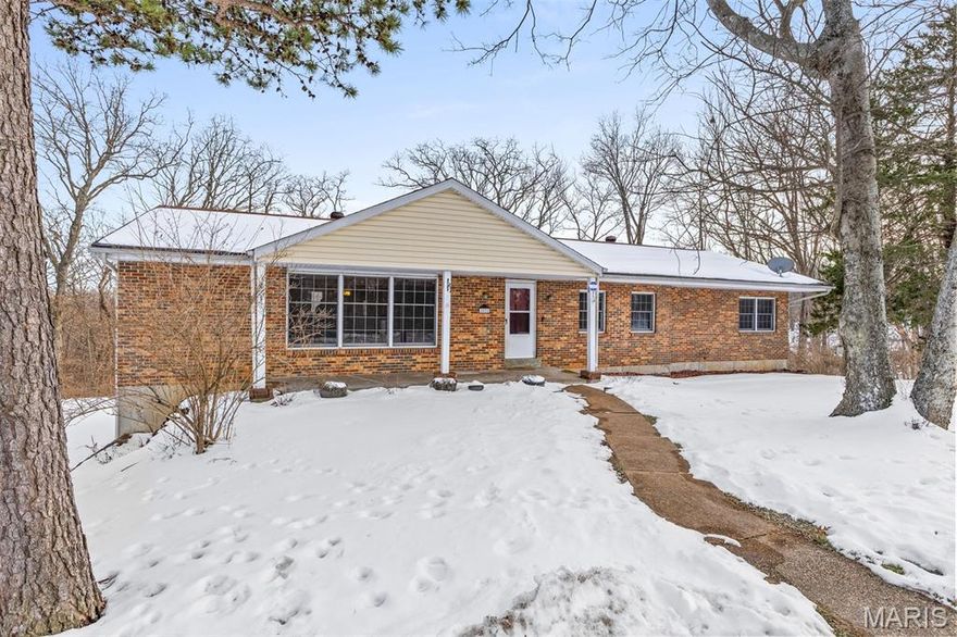 This brick-front home provides over 3200 square feet of total living space and sits on nearly an acre of land in a very small and quiet subdivision with only eight homes, a dead-end street, and great neighbors.  It provides tons of privacy, seclusion, and wildlife in a country setting while being only minutes away from shops and restaurants.  Walk through the front door into a large family room that includes a wood-burning fireplace.  Walk around the corner into a large dining area and kitchen with an open floor plan, and a large main floor laundry room with lots of cabinets off the kitchen.  Down the hall you will find 3 bedrooms and 2 full baths.  The partially finished lower level adds over 1000 sq ft of recreation space, another bathroom, and 3 egress windows to allow lots of flexibility in finishing it further.  Lots of updates include a new HVAC system (2024), new electric panel (2025), radon mitigation (2022), newer carpet in the living room and master bedroom, newer 6-panel doors, and newer paint throughout most of the house.  Minutes from Ferd B Lang Park and the Arnold Recreation Center.  Home to be sold as-is with no municipal inspections completed by seller and any buyer inspections for information only.  Kitchen refrigerator and shed in the backyard stay with the home.