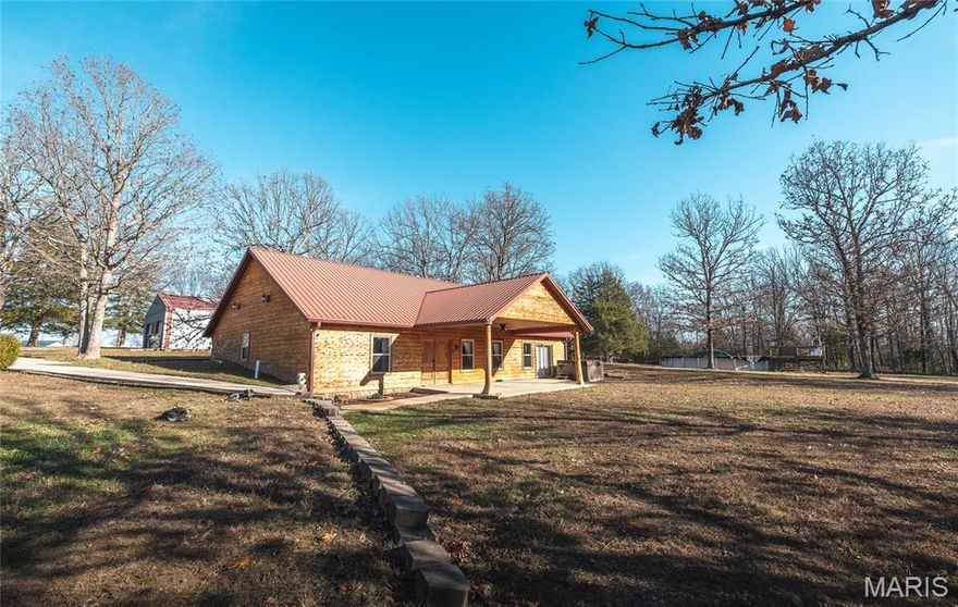 Located in Pulaski County, MO this charming 3-bedroom, 2-bathroom home offering over 2,200 sq ft of comfortable living space. Wrapped in wood siding for a classic log-cabin feel, this property sits on approximately 8 m/l acres of mostly wooded land—perfect for anyone who loves privacy, nature, and room to roam. A pond adds to the beauty of the setting, while an above-ground pool offers a great spot to cool off during warm Missouri summers. The property also features a 2-bay detached shop, ideal for storage, parking, or your favorite hobbies. Located in the Laquey School District, this home provides a blend of country living and convenience. Approximately 20 minutes from Ft. Leonard Wood and joins National Forest for great deer and turkey hunting.