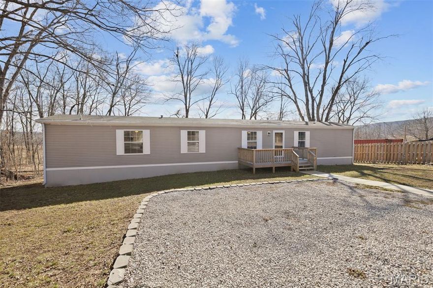 Move-in ready and beautifully updated, this 3-bedroom, 2-bath manufactured home offers modern comfort tucked into peaceful surroundings. Inside, you’ll find thoughtful updates throughout including a brand-new kitchen, all new flooring, new windows and doors, and a new A/C unit to keep things comfortable year-round. The open-concept layout creates an easy flow for everyday living or entertaining, while the spacious primary suite features a walk-in closet and double sinks for added convenience.

Set on a generous 0.51± acre lot, the property offers plenty of space to spread out along with a gravel driveway for ample parking. Step outside onto the new wooden deck just off the kitchen—the perfect spot to enjoy quiet mornings, watch wildlife, or take in the beautiful sunsets this area is known for.

Located just over a mile from town, you’ll enjoy the balance of convenience and quiet living. Outdoor enthusiasts will especially love the location, with hiking and biking trails just a short walk away and boating or fishing at Shepard Mountain Lake nearby. Surrounded by the natural beauty of the Arcadia Valley—including clear streams, small lakes, Mark Twain National Forest, and multiple state parks—this property offers easy access to some of Missouri’s best outdoor recreation.