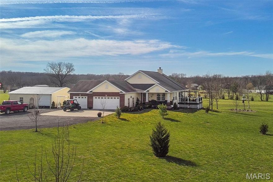 Life in the country doesn't get much better.  Showcasing nearly 3500 finished sq ft with 4 bedrooms and 3 FULL baths this home has what many look for.  Peace and Quiet with booming views of the pond and farm fields in all their glory.  This handsome home features an OVERSIZED 3 CAR GARAGE plus an insulated 31X24 outbuilding/shop.  Inside you'll enjoy a nice open floorplan with separate dining plus a wood burning fireplace in the comfortable great room.  The huge kitchen has lots and lots of cabinets and counter space and the fridge can remain.  The en-suite offers vaulted ceilings and more than enough space for a full bedroom set.  The FINISHED walk out lower has a legitimate 4th bedroom and TWO ADDITIONAL SLEEPING ROOMS.  If you have EVER thought about getting out of the craziness of St Charles County and getting to a place of peace, look here.  Homes with PONDS AND OUTBUILDINGS combined are an absolute RARITY.  This has both and so much more to offer someone who'd like to trade the noise of traffic and congestion for the sounds of nature.