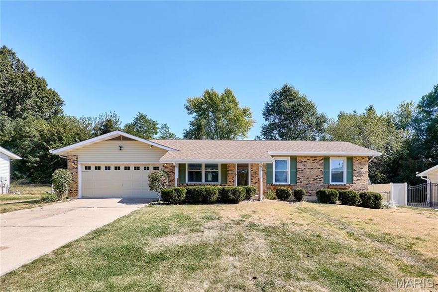Welcome home to this beautifully renovated 4-bedroom, 3-bath ranch in one of St. Charles’ most convenient and desirable neighborhoods. Step inside from the inviting covered front porch to find luxury vinyl plank flooring flowing throughout the main level, creating a warm and cohesive feel. The light-filled living room connects seamlessly to the dining area and kitchen, where clean white cabinets and stainless steel appliances make meal prep a joy. Off the dining room, a charming three-season room opens to the backyard with a covered patio and large storage shed — the perfect setup for barbecues, kids’ playtime, or family gatherings.
A surprise highlight is the spacious family room with big windows and a cozy wood-burning fireplace, offering the ideal spot for movie nights or game days. The main level also features a comfortable primary suite with private bath, two additional bedrooms, and an updated hall bath. Downstairs, the finished lower level adds incredible flexibility with a second bedroom suite, full bath, and walk-up access to the backyard — perfect for guests, teens, or multi-generational living.
This move-in-ready home combines modern updates with thoughtful spaces designed for everyday family life. Recent Upgrades: Roof 2024, AC 2025, Flooring 2025, Paint 2025