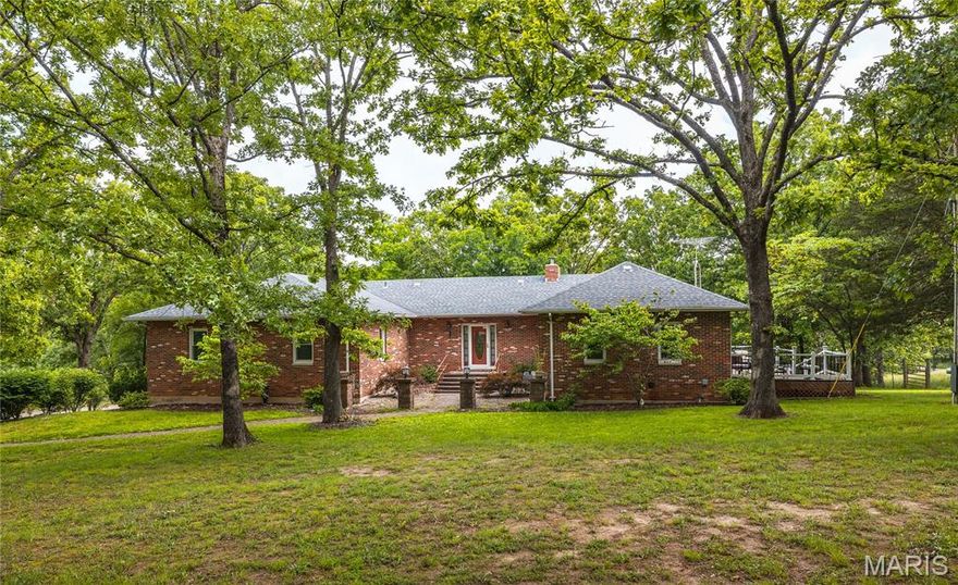 Welcome to your dream homestead! Nestled on 61.5 acres of beautiful, fully fenced land, this exceptional property offers the perfect blend of comfort, functionality, and rural charm. Whether you're looking for a private residence, a family retreat, or a fully operational cattle property, this one checks all the boxes. The main level of the home features 5 spacious bedrooms, 3 full bathrooms, kitchen, and Laundry providing ample space for family and guests. Enjoy an open and inviting floor plan with generous living areas, ideal for entertaining or relaxing in peaceful country surroundings. The fully finished walk-out basement offers additional living space, along with a full kitchen, laundry, and full bathroom.  There is a nice recreation room, or perhaps a guest quarters, or even a separate apartment setup. The main level and basement each offer a fireplace creating a comfortable and inviting space. The home also includes a 2-car attached garage, offering convenience and storage. Step outside and you'll find a large barn currently set up for cattle operations or horses, a pond, and a nice mixture of woods and pasture ready for grazing or agricultural use. The land is ideal for a working farm, hobby farming, or simply enjoying the outdoors in privacy. This property and surrounding area is also known for its exceptional deer and turkey hunting. Whether you're seeking a permanent residence or a weekend getaway, this property offers space, serenity, and unlimited potential.