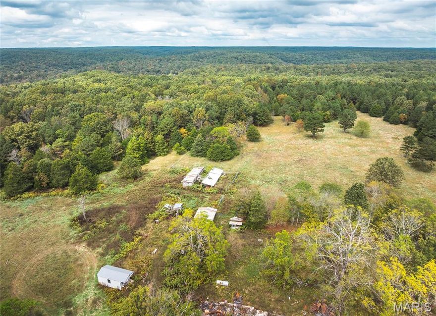 Discover your own slice of Ozark heaven on this 284-acre private retreat, offering the perfect mix of mature timber, open pastureland, and scenic beauty. This property is an outdoorsman's dream, featuring 4 rustic hunting cabins – ready for your weekend getaways or hunting trips. Two year-round creeks and a natural spring with a 5-foot waterfall. Extensive trail system – ideal for UTVs, horseback riding, or hiking. Abundant wildlife whitetail deer, wild turkey, and small game abound. Fenced pastures, ponds, and loafing sheds ready for horses, cattle, or other livestock. The property sits at the end of a quiet road no through traffic just peace and nature. Located in the heart of the Ozarks, you’re only a short drive from the Ozark National Scenic Riverways and Peck Ranch Conservation Area, home to Missouri’s elk herd. Despite its remote feel, this property is conveniently close to towns offering shopping, hospitals, and restaurants. Whether you’re dreaming of a self-sufficient homestead, hunting lodge, or private nature retreat, this property truly has it all. A must-see for anyone seeking beauty, privacy, and freedom in the Ozarks.