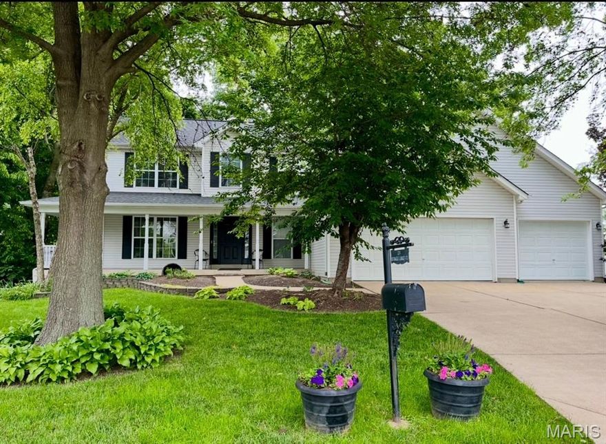 Spacious and beautifully updated 5-bedroom, 3.5-bath home in the highly desirable Fort Zumwalt West School District! Offering 2,600+/-sq ft above grade plus approximately 1,000+/- sq ft of finished LL living space, this home delivers the expansive living for today’s buyers. The kitchen features handcrafted concrete countertops, shiplap backsplash, wine/drink refrigerator, and SS appliances. Walk out the kitchen slider to a lovely deck featuring horizontal cable railing with stairs to the backyard. The main-floor primary suite provides convenience and privacy, with a large walk in closet, and a brand new luxurious retreat with double sinks, stand alone soaking tub, & a custom tiled shower with frameless neo-angle matte black grid doors. Upstairs you will find 3 bedrooms, two with walk-in closets, and an updated hall bathroom. The newly finished lower level features a recreation room, a bedroom and full bathroom — ideal for guests, multi-generational living, or a private office retreat. Completing the LL is a storage area/workshop. This home comes with a long list of updates (please see feature sheet for the full list) to include brand-new sliding glass doors, luxury primary bath, new LL bath, and numerous interior improvements throughout. Impressive curb appeal with established landscaping creates a welcoming exterior, paired with the convenience of a three car garage offering flexibility and ample storage. With generous room sizes, multiple living areas, and over 3,500 sq ft of total finished space, this home offers flexibility, function, and value in one of the most sought-after school districts. Entry cabinet included in sale. Wonderful location, close to shopping, parks, and 364. Please see feature sheet for upgrades.