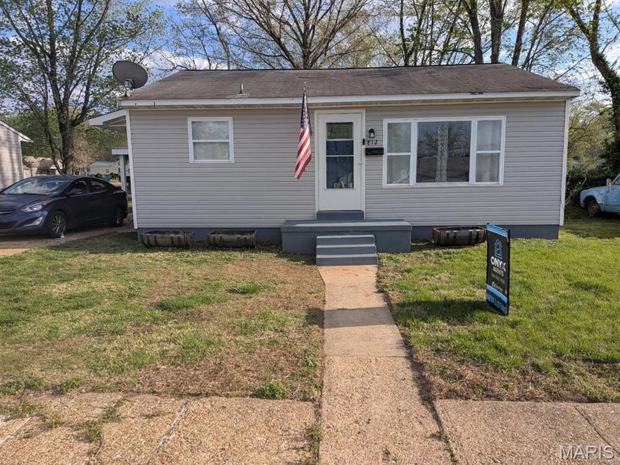 Located near the community center, local parks, and the fairgrounds, this efficient 1-bedroom home offers a practical layout with several recent updates. The interior features original hardwood flooring in the living room, bedroom, and the versatile bonus room, which is well-suited for a home office or additional sleeping area.

The eat-in kitchen has been refreshed with newly painted cabinetry and refinished countertops. All appliances, including the stainless steel refrigerator and stove, stay with the home. A dedicated main-floor laundry room provides added convenience, with the washer and dryer included in the sale.

The home is all-electric and utilizes radiant baseboard heat, supplemented by three window units and ceiling fans for cooling. Outside, the property includes a fully fenced backyard and a substantial 15x11 outbuilding. This shop space is equipped with a concrete floor, electricity, built-in cabinetry, a workbench, and shelving, providing excellent utility for storage or projects.

Please note: Property is being sold in its current 'as-is' condition. While the seller welcomes inspections for buyer's knowledge, no repairs or credits will be provided.  All information is deemed reliable but not guaranteed. Buyer to verify all information, including but not limited to room sizes, square footage, school districts, and taxes.  Outbuilding dimensions are approximate; buyer to verify.