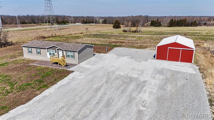 Welcome to your private slice of country living! Built in 2023, this 3-bedroom, 2-bath home sits on 12 acres of beautiful, flat ground—just 8 minutes from Highway 70! Inside, enjoy an open floor plan with natural light, spacious kitchen island, and a cozy fireplace perfect for gatherings. A standout feature is the 30x60 outbuilding with its own half bath - perfect for a workshop, storage, hobbies, or additional parking. With plenty of space and privacy, this home is ideal for a hobby farm—bring your goats, chickens, horses, and country-living dreams! The level acreage provides exceptional flexibility and is well-suited for potential subdivision into three separate lots, offering added value and opportunity for future development or investment. Whether you're looking for a homestead, recreational retreat, or future opportunity, this property checks all the boxes! Home is manufactured but permanently affixed with a recorded affidavit—classified as real property and financeable. Don’t miss your chance to own this 3-year-old, move-in-ready home with modern conveniences and room to roam. Showings begin Thursday 3/26 - Open House Sunday 3/29 10-12! Schedule your own private showing today!