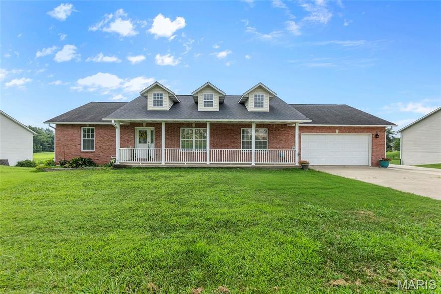 Enjoy front porch living or the serene view from the back deck in this quiet neighborhood.  Inside offers vaulted ceilings, split bedrooms, freshly painted, and new carpet. The kitchen is eat in with a bar top as well as dining space.  A total of 5 bedrooms this home has space for everyone! The lower level has family room, bedroom and bath space. The private backyard looks out over an open field.  The garage is oversized and the lower level offers abundant storage with wood shelves.