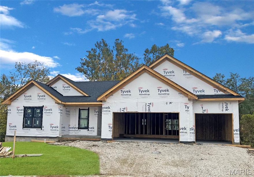 Inventory Home under construction will be ready in June. If you’ve been searching for a home with a private backyard, beautiful scenery, and walkability to parks, trails, and shopping, this one is for you.
Inside, you’ll find the modern finishes today’s buyers expect. The open-concept floor plan features high ceilings, abundant natural light, and a seamless flow between the kitchen, dining, and living areas, perfect for gatherings or cozy nights in. The kitchen is beautifully appointed with quartz countertops, a large center island for gathering, stylish cabinetry, stainless appliances, and on-trend lighting. Durable flooring, neutral designer paint colors, and thoughtful details throughout make this home move-in ready.
The primary suite offers a private escape with a spacious layout, walk-in closet, and well-designed bath. Additional bedrooms provide flexibility for guests, a home office, or growing families.
Location truly sets this home apart. Enjoy being close to shopping, dining, and everyday conveniences while also being walkable to nearby parks and scenic trails. Live where you can step outside and instantly connect with nature, without sacrificing accessibility.
Homes with wooded backyards, scenic views, and this level of finish in Washington don’t last long. Schedule your private showing today and experience the lifestyle this property offers.  Options in this new inventory home include: Three car garage + 2' added for depth.  Luxury kitchen with upgraded "coastline" cabinets, quartz countertops, 42" cabinets, pull out pantry, large island with plenty of seating and upgraded appliance package.  10' ceilings in common area, 9' throughout, and a 9' basement pour. Covered back deck and large patio all included on this premium homesite at Stone Bridge.

Front elevation will showcase brick to sill height with stone column base. Warm tones with 6x6 Cedar post with 6x8 cedar beam at front porch for added detail. Double gable over the front porch. Vertical board and batten front facing siding in sand color with toasted almond accents and black windows.

 Whether you’re entertaining on the patio or simply enjoying quiet evenings outdoors, the wooded backdrop creates a true retreat feel while still being minutes from everything Washington has to offer.

 This new development boasts large homesites, fantastic views and treelined backyards.  Northern Star has been building Homes in Washington Missouri for over 25 years. Your foundation, framing, electrical, plumbing, roofer and finish carpentry are made up of local skilled tradesman who take pride in their work and in their hometown.

Northern Star Homes - your hometown builder.